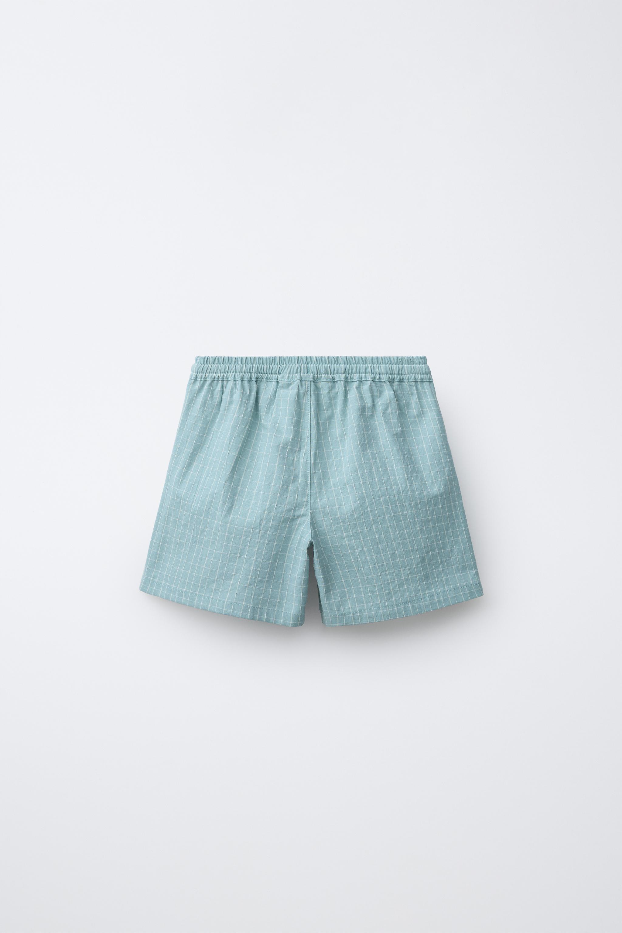 BUTTONED PLAID SHORTS